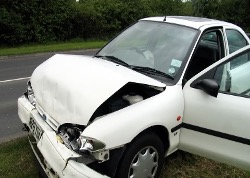 Motor Vehicle Injury Treatment. Auto after accident with severe front end damage.